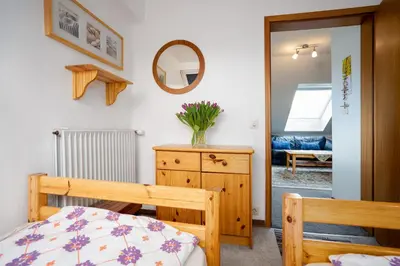 Ein Bett oder Betten in einem Zimmer der Unterkunft HER14b Ferienwohnung Hartig