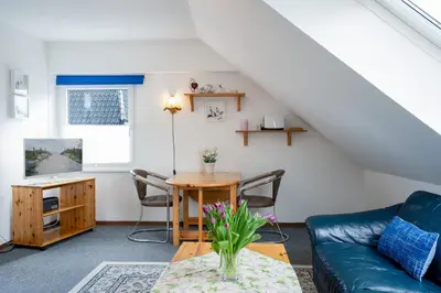 Ein Sitzbereich in der Unterkunft HER14b Ferienwohnung Hartig