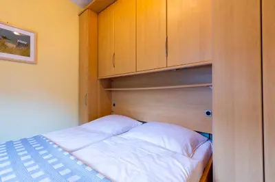 Ein Bett oder Betten in einem Zimmer der Unterkunft MEI6b Ferienwohnung Matysik