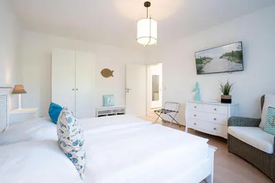Ein Bett oder Betten in einem Zimmer der Unterkunft MEI71 Ferienwohnung Strandlust F