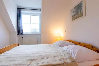 Ein Bett oder Betten in einem Zimmer der Unterkunft OST10b Ferienwohnung Musik-Jischa