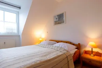 Ein Bett oder Betten in einem Zimmer der Unterkunft OST10b Ferienwohnung Musik-Jischa
