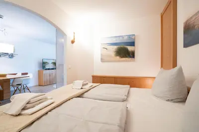 Ein Bett oder Betten in einem Zimmer der Unterkunft Ost11a Ferienwohnung Strandnah