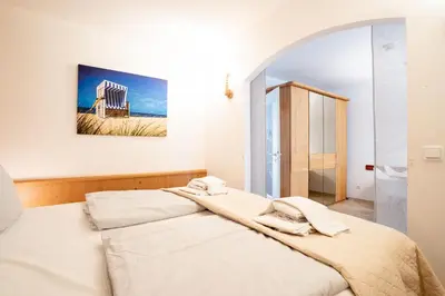 Ein Bett oder Betten in einem Zimmer der Unterkunft Ost11a Ferienwohnung Strandnah
