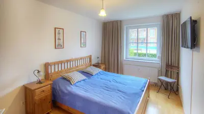 Ein Bett oder Betten in einem Zimmer der Unterkunft OST16 Ferienwohnung Wackerow