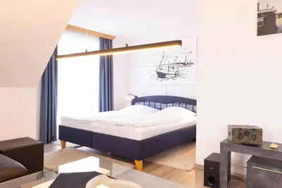 Ein Bett oder Betten in einem Zimmer der Unterkunft OST29 Ferienwohnung Komoran