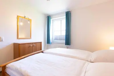 Ein Bett oder Betten in einem Zimmer der Unterkunft OST9 Ferienwohnung Kruse