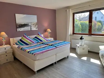 Ein Bett oder Betten in einem Zimmer der Unterkunft STOE12b Ferienhaus Sonne, Wohnung Sonnenterrasse