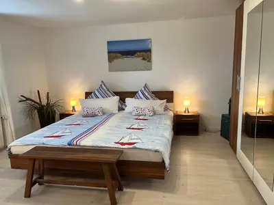 Ein Bett oder Betten in einem Zimmer der Unterkunft STOE12c Ferienhaus Sonne, Wohnung Sonnenschein