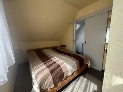 Ein Bett oder Betten in einem Zimmer der Unterkunft STOE 14a Gästehaus Iden, App 3