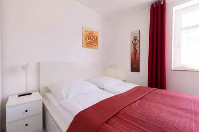 Ein Bett oder Betten in einem Zimmer der Unterkunft STR123L Ferienwohnung Sarah