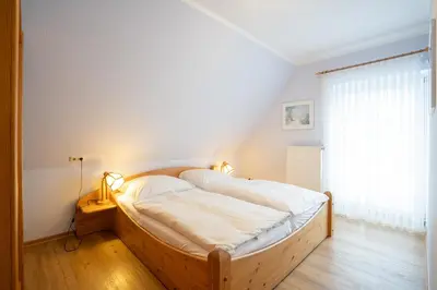 Ein Bett oder Betten in einem Zimmer der Unterkunft STR47a Ferienwohnung Heitmann