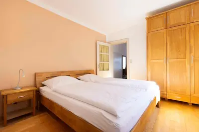 Ein Bett oder Betten in einem Zimmer der Unterkunft STR73 Haus Meeresblick