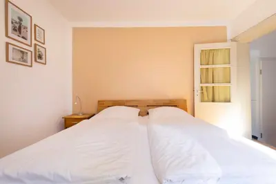 Ein Bett oder Betten in einem Zimmer der Unterkunft STR73 Haus Meeresblick