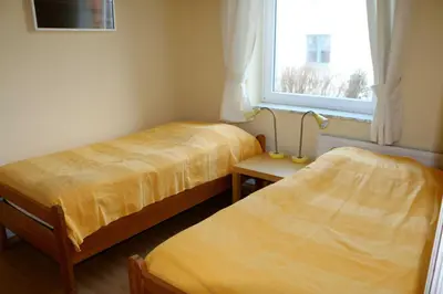 Ein Bett oder Betten in einem Zimmer der Unterkunft STR81b Ferienwohnungen Steinmetz - Landseite