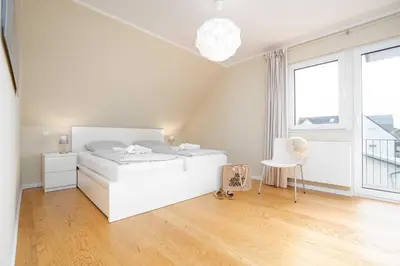 Ein Bett oder Betten in einem Zimmer der Unterkunft STR92b Ferienwohnung Strandzeit F