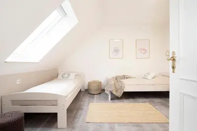 Ein Bett oder Betten in einem Zimmer der Unterkunft Haus Pegasus Küstenliebe