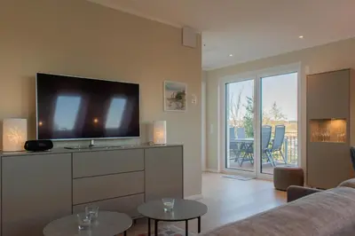 TV/Unterhaltungsangebot in der Unterkunft Ferienwohnung Beachbreak - Stilvolle Ferienwohnung an der Ostsee
