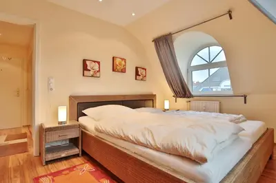 Ein Bett oder Betten in einem Zimmer der Unterkunft Ferienhaus Bergstraße 60 Ferienhaus Bergstraße Appartement 9