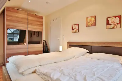 Ein Bett oder Betten in einem Zimmer der Unterkunft Ferienhaus Bergstraße 60 Ferienhaus Bergstraße Appartement 9