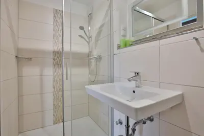 Ein Badezimmer in der Unterkunft Haus Miramar TREF Appartement 64