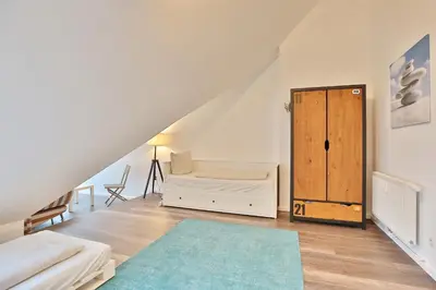 Ein Bett oder Betten in einem Zimmer der Unterkunft Strandduene Stranddüne Appartement 23