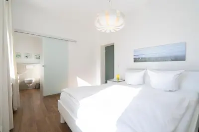 Ein Bett oder Betten in einem Zimmer der Unterkunft Ferienwohnung Capolino