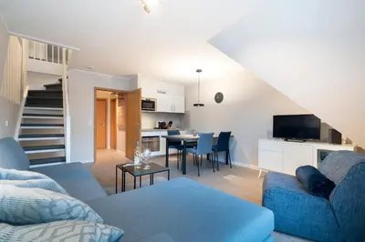 Ein Sitzbereich in der Unterkunft Ferienwohnung Hygge