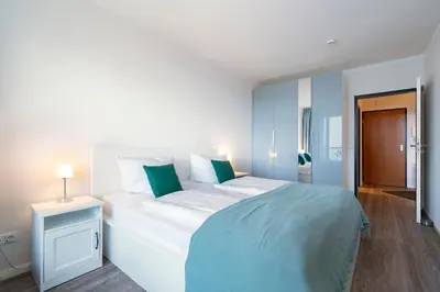 Ein Bett oder Betten in einem Zimmer der Unterkunft Ferienwohnung Meeresstrand, App 206
