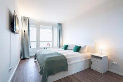 Ein Bett oder Betten in einem Zimmer der Unterkunft Ferienwohnung Meeresstrand, App 206