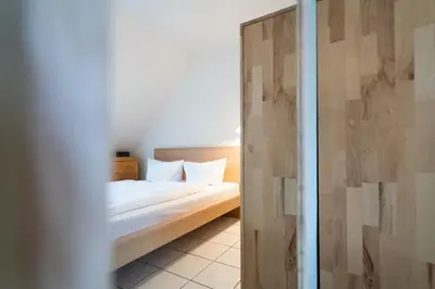 Ein Bett oder Betten in einem Zimmer der Unterkunft Wohnpark am Mühlenteich - Appartement 24