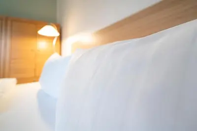 Ein Bett oder Betten in einem Zimmer der Unterkunft Wohnpark am Mühlenteich - Appartement 24