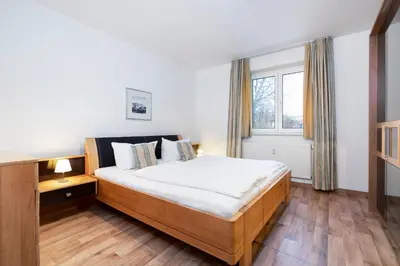 Ein Bett oder Betten in einem Zimmer der Unterkunft Wohnpark am Mühlenteich - Appartement 31