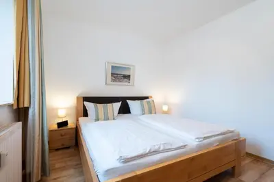 Ein Bett oder Betten in einem Zimmer der Unterkunft Wohnpark am Mühlenteich - Appartement 27