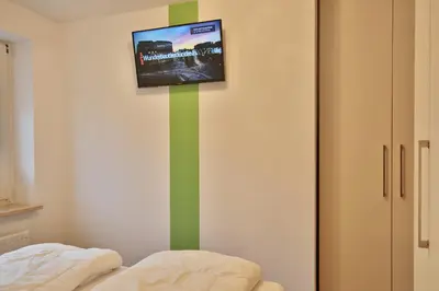 Ein Bett oder Betten in einem Zimmer der Unterkunft Haus Windrose Appartement 4