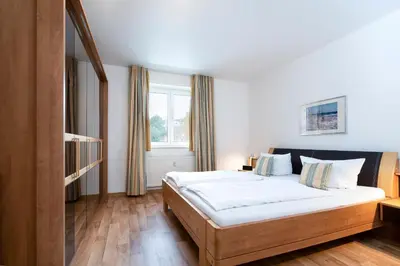 Ein Bett oder Betten in einem Zimmer der Unterkunft Wohnpark am Mühlenteich - Appartement 32