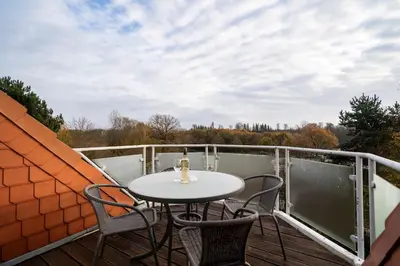 Ein Balkon oder eine Terrasse in der Unterkunft Wohnpark am Mühlenteich - Appartement 37