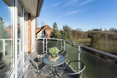 Ein Balkon oder eine Terrasse in der Unterkunft Wohnpark am Mühlenteich - Appartement 38