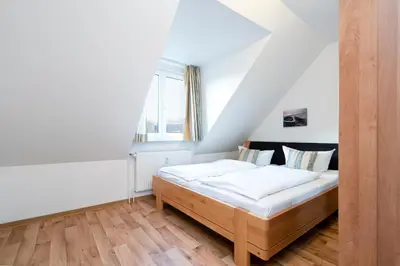 Ein Bett oder Betten in einem Zimmer der Unterkunft Wohnpark am Mühlenteich - Appartement 39