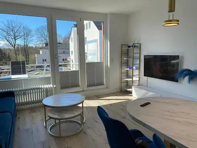 Ein Sitzbereich in der Unterkunft Modernes Apartment an Timmendorfer Promenade, 1. Reihe