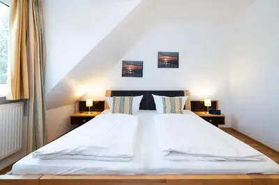 Ein Bett oder Betten in einem Zimmer der Unterkunft Wohnpark am Mühlenteich - Appartement 34