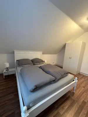 Ein Bett oder Betten in einem Zimmer der Unterkunft FeWo Haus Lübeck Sereetz Ostsee