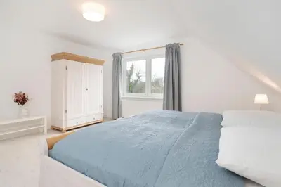 Ein Bett oder Betten in einem Zimmer der Unterkunft Daddeldu