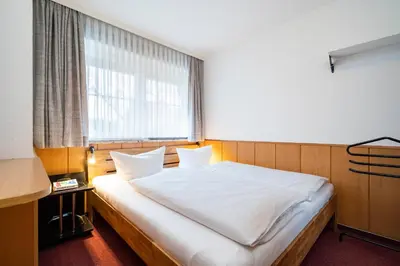 Ein Bett oder Betten in einem Zimmer der Unterkunft Gorch-Fock-Park App 3