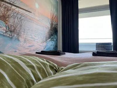 Ein Bett oder Betten in einem Zimmer der Unterkunft Ostsee Ferienwohnung in Sierksdorf - Hansa Park