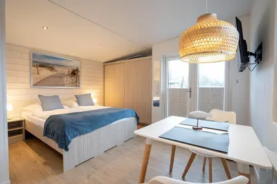 Ein Bett oder Betten in einem Zimmer der Unterkunft Ostseecamp Lübecker Bucht 