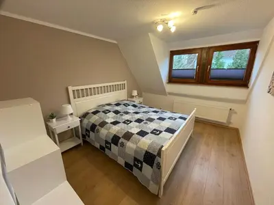 Ein Bett oder Betten in einem Zimmer der Unterkunft Ferienhaus Groß Grönau
