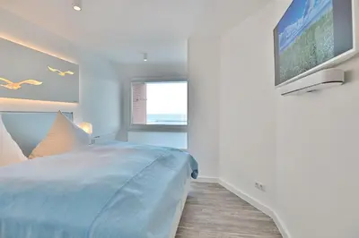 Ein Bett oder Betten in einem Zimmer der Unterkunft Haus Nautica Nautica Appartement 32