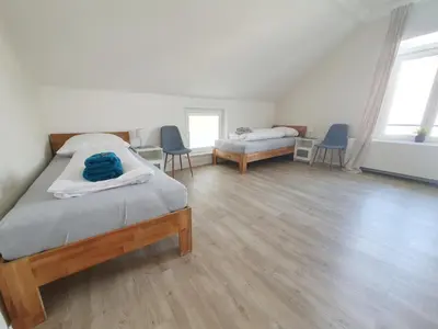 Ein Bett oder Betten in einem Zimmer der Unterkunft Ferienwohnung Stadtvilla - charmante Gemütlichkeit