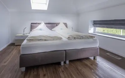 Ein Bett oder Betten in einem Zimmer der Unterkunft Villa am Rethwarder